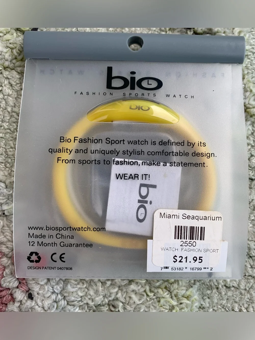 yellow Bio digital sports watch inside its translucent packaging